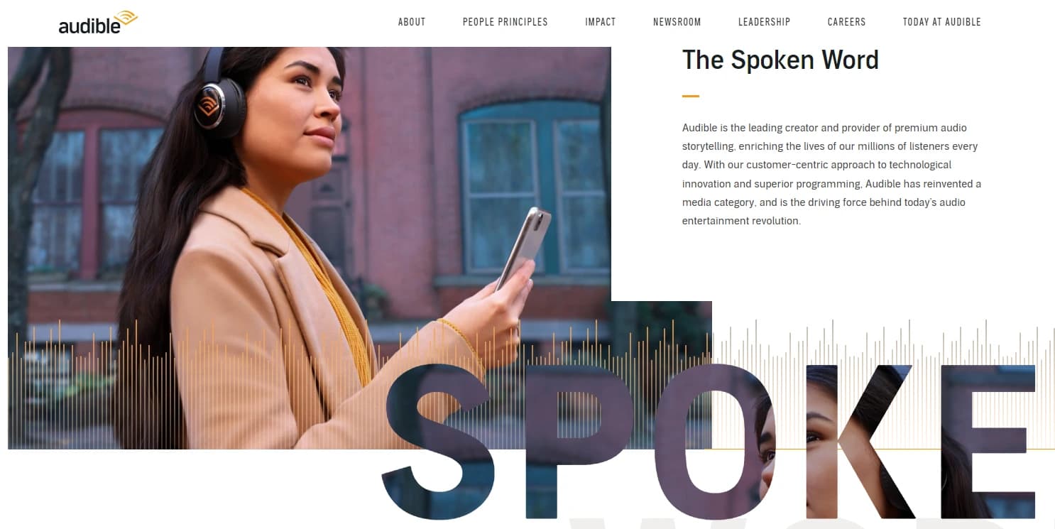 A woman wearing headphones holds a smartphone. Text reads "The Spoken Word" with a soundwave graphic and Audible branding in the background.