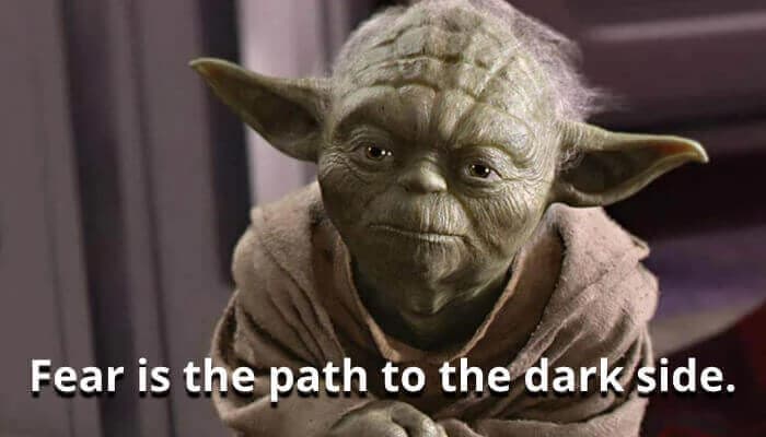 Yoda from Star Wars, wearing a brown robe, with the quote "Fear is the path to the dark side" displayed below.