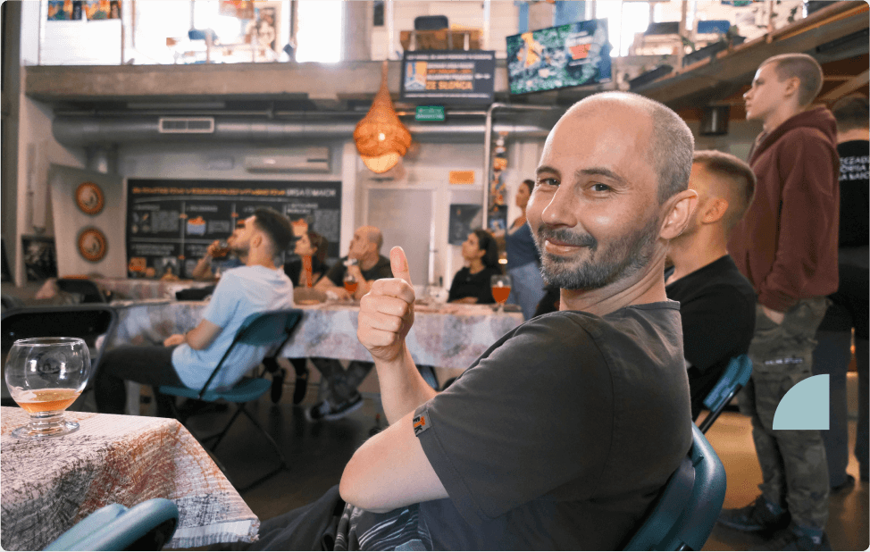 Naturaily employee making a thumbs-up while sitting at the table